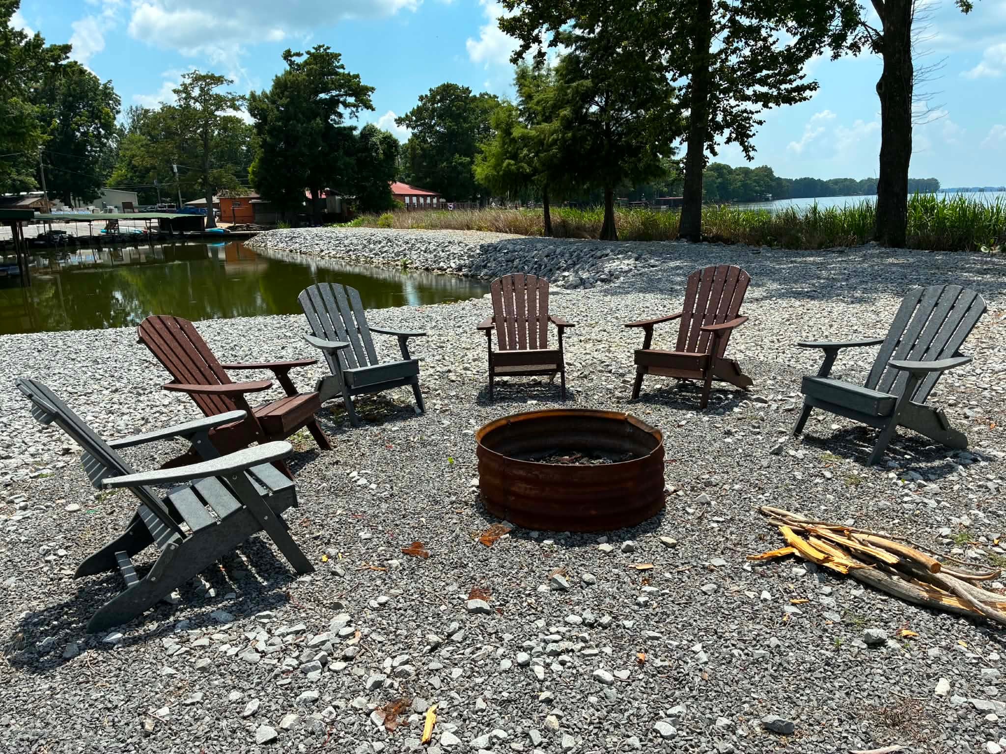 Lakeside fire pit with Adirondack chairs