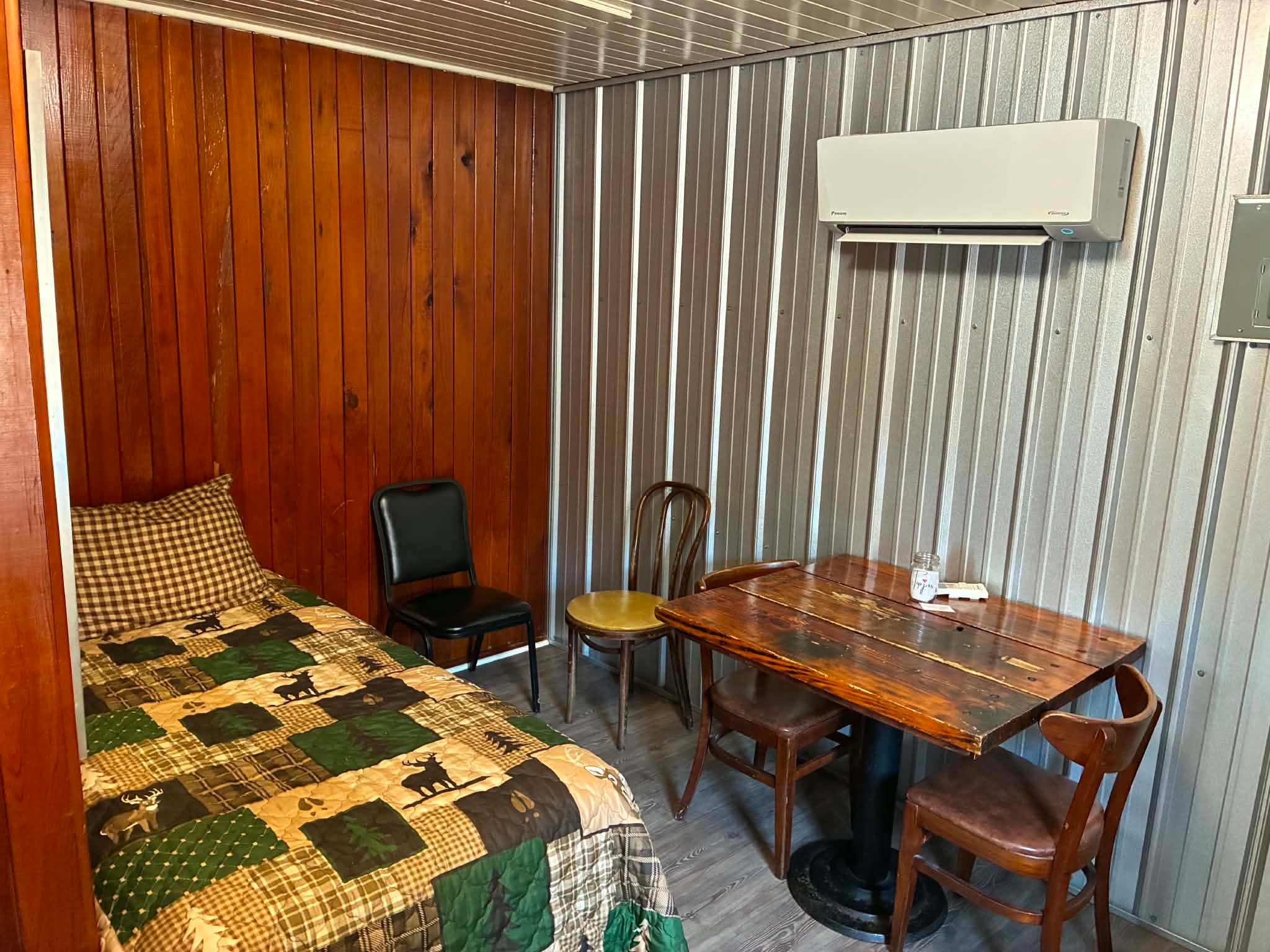 Standard Cabin room with bed and dining table