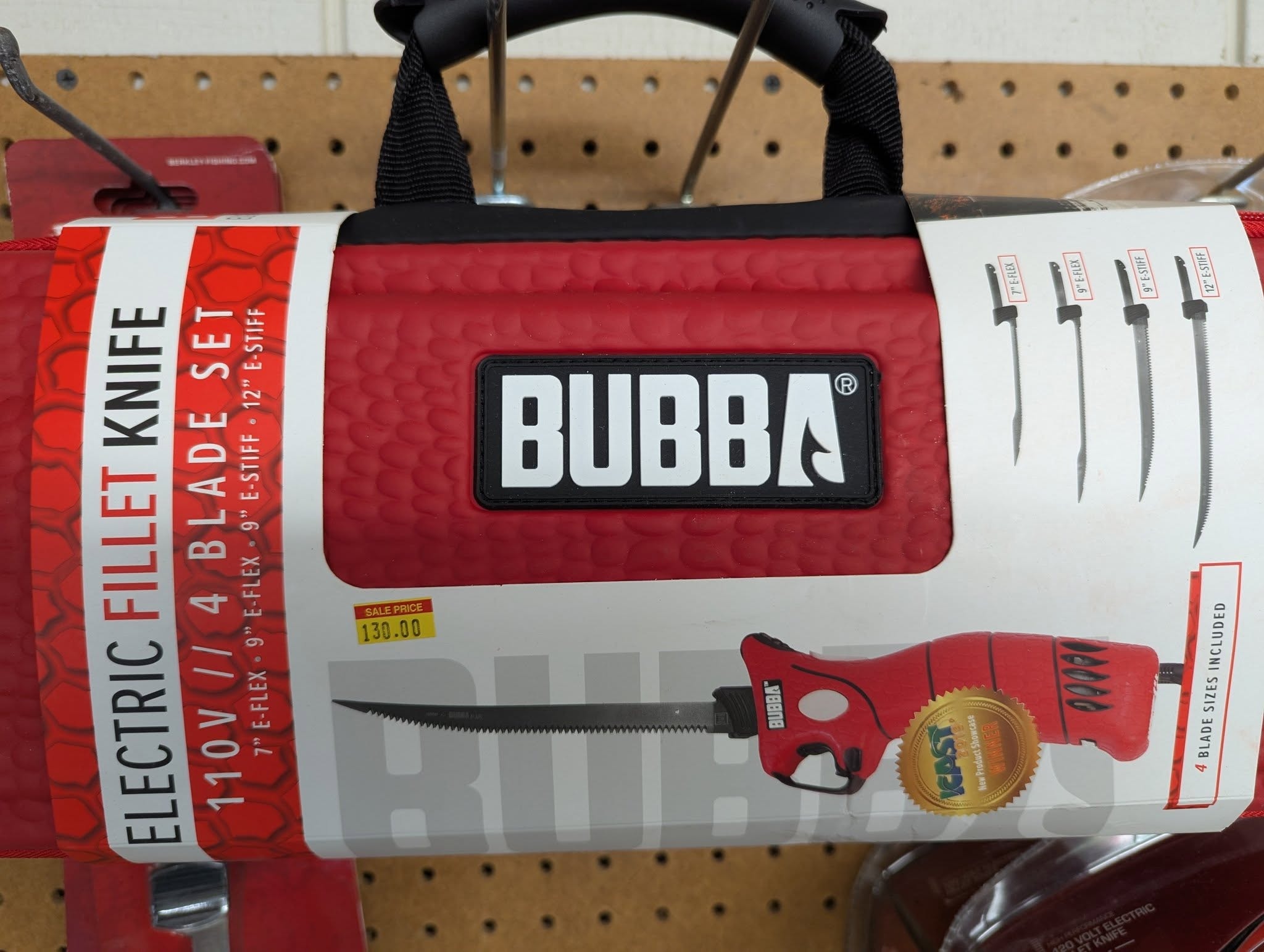 Bubba electric fillet knife set on the pegboard wall