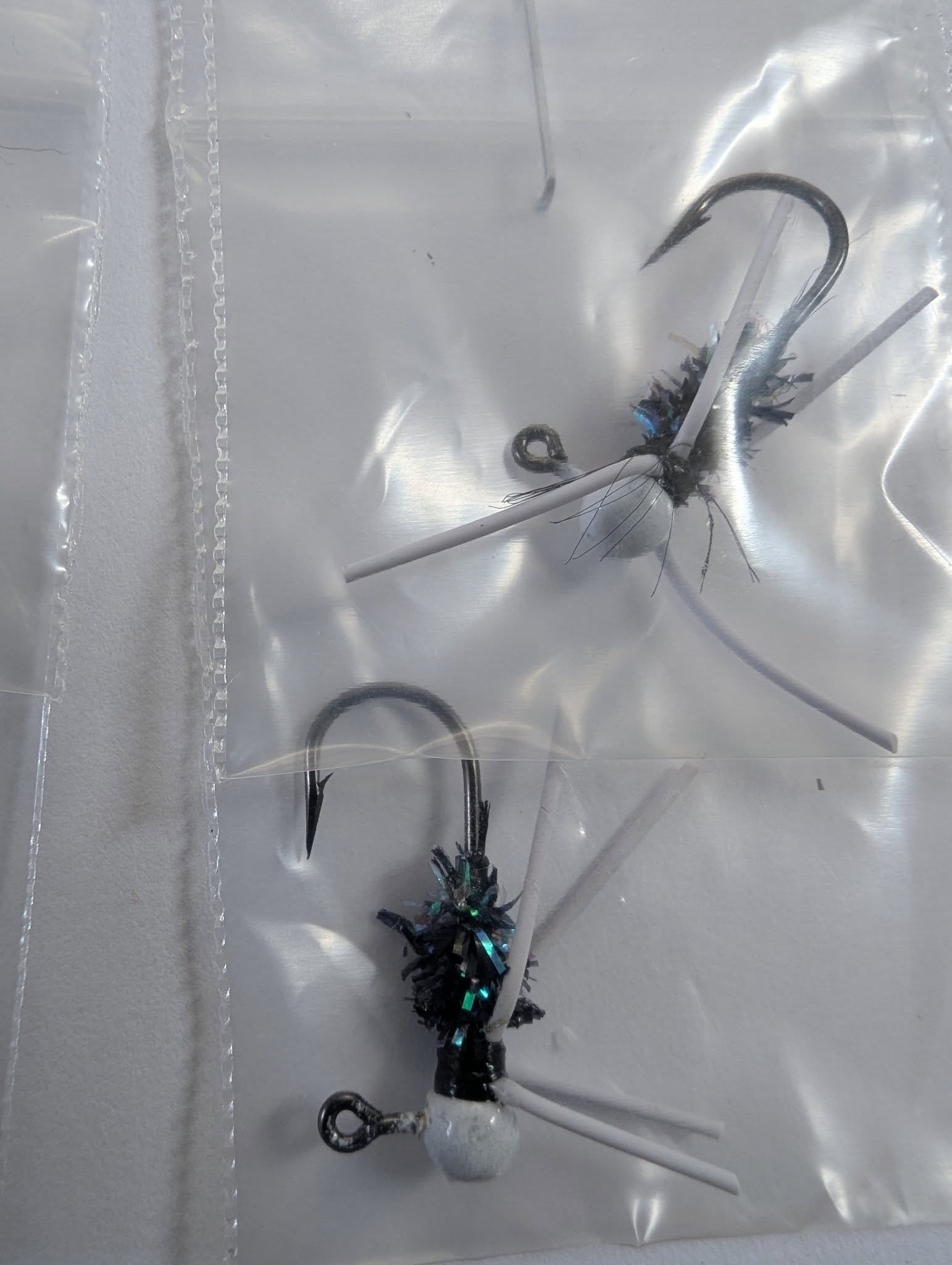 Black and teal hand-tied crappie jig close-up
