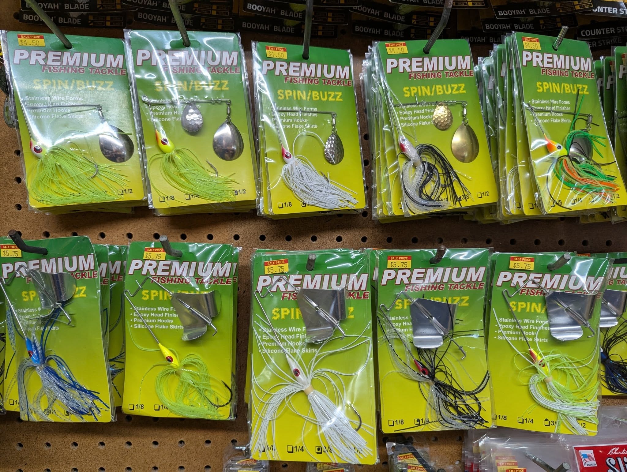 Premium Fishing Tackle Spin/Buzz spinnerbaits on the pegboard display wall