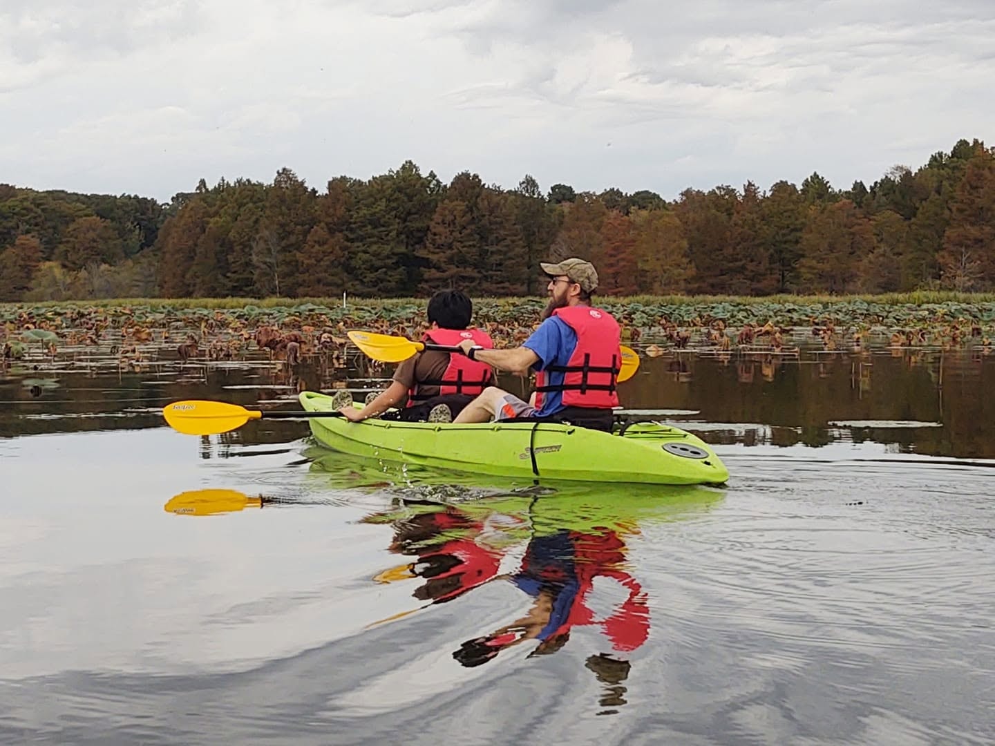 Two people kayaking in a tandem kayak on Reelfoot Lake