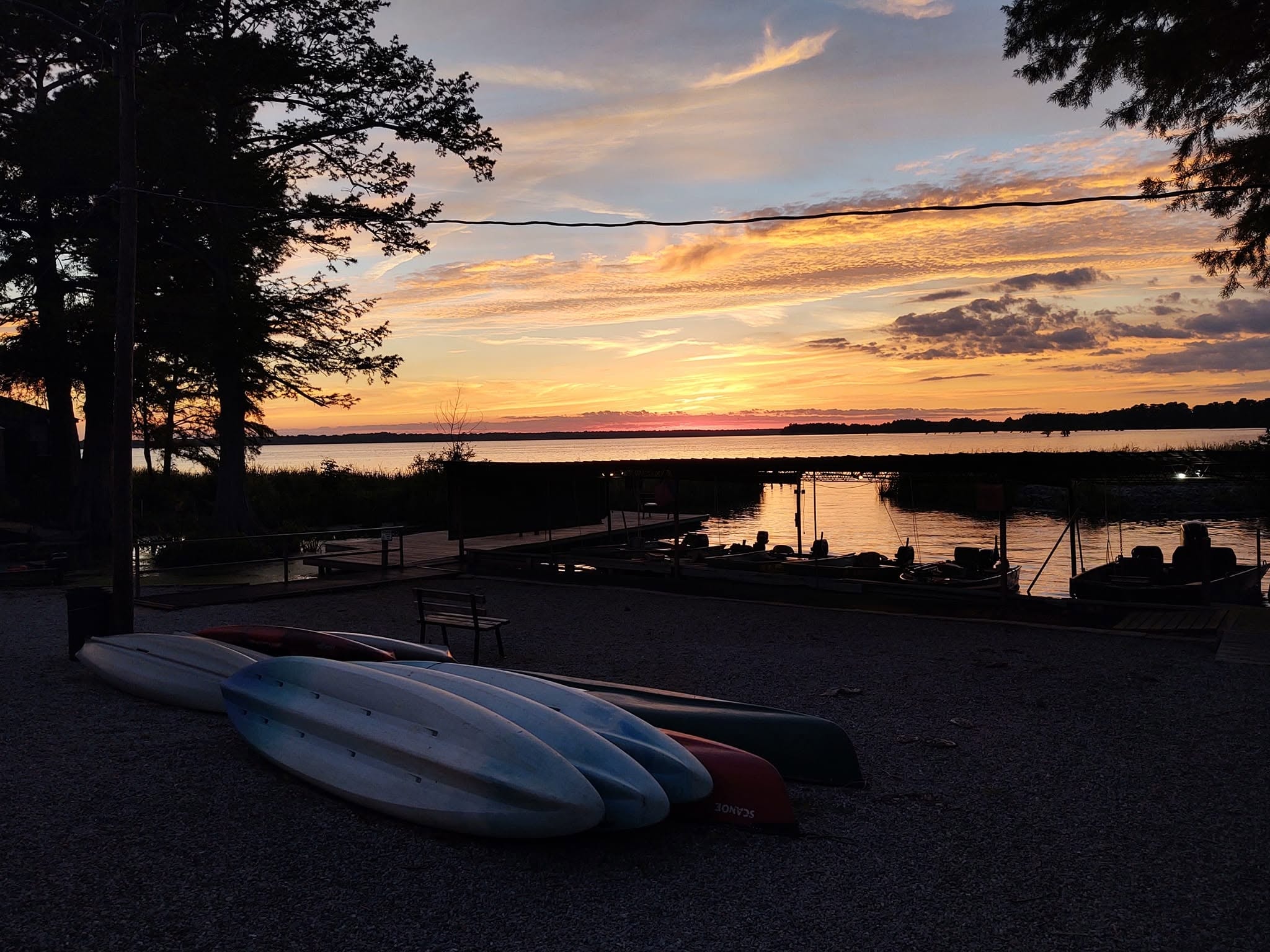 Kayaks and canoes at sunset on Reelfoot Lake