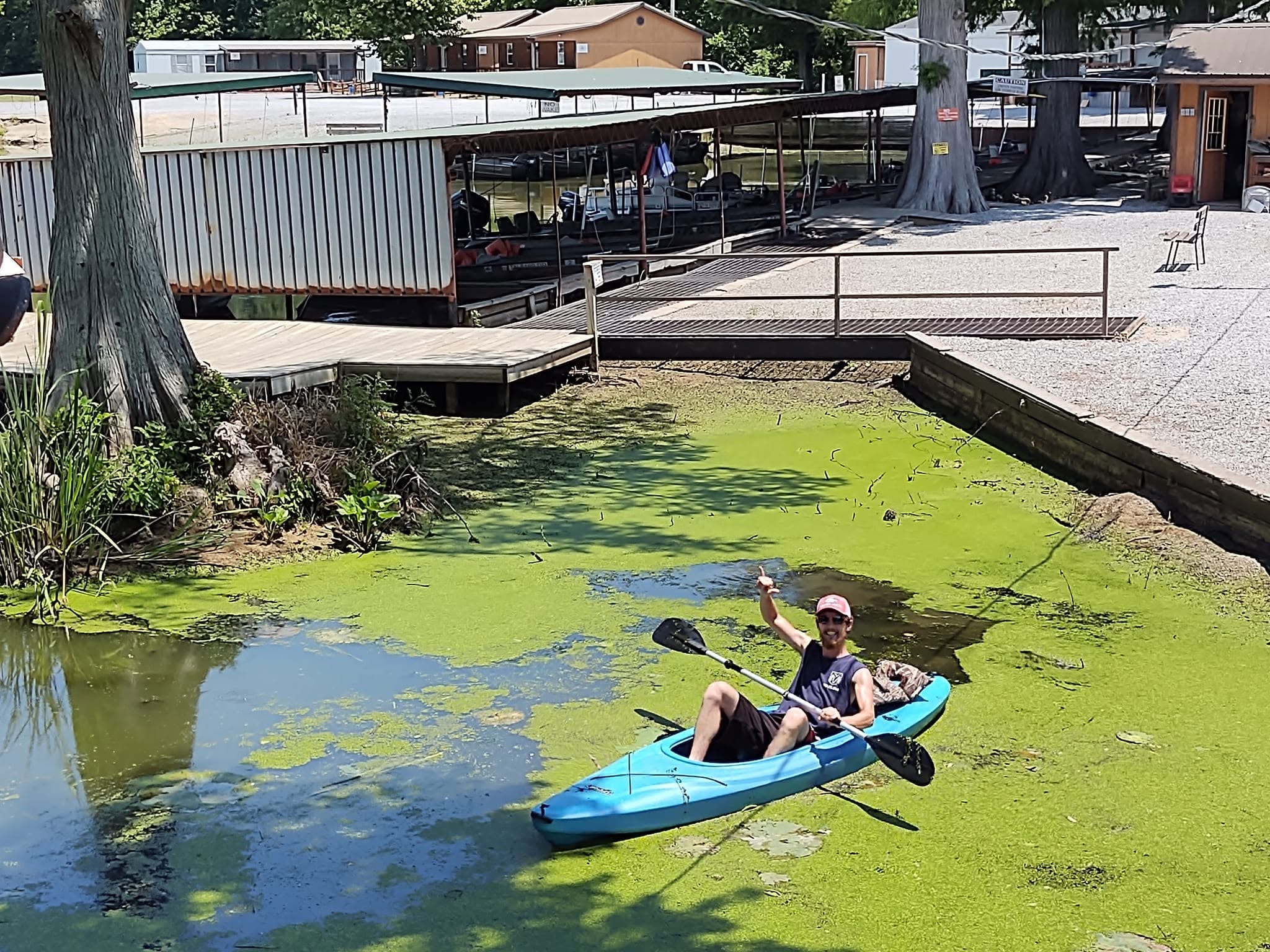 Guest kayaking through the green waterway at Southshore Resort