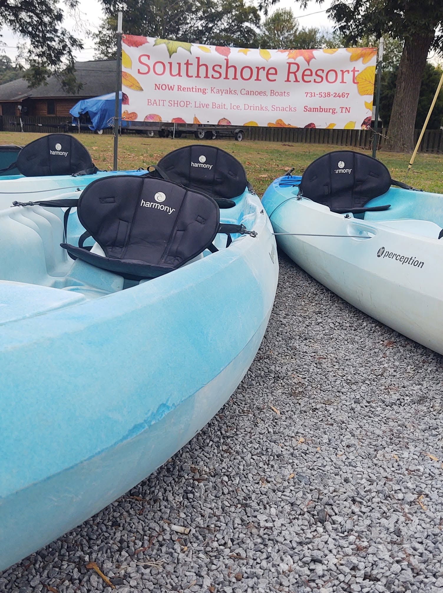 Southshore Resort kayaks ready to rent with resort rental banner in background
