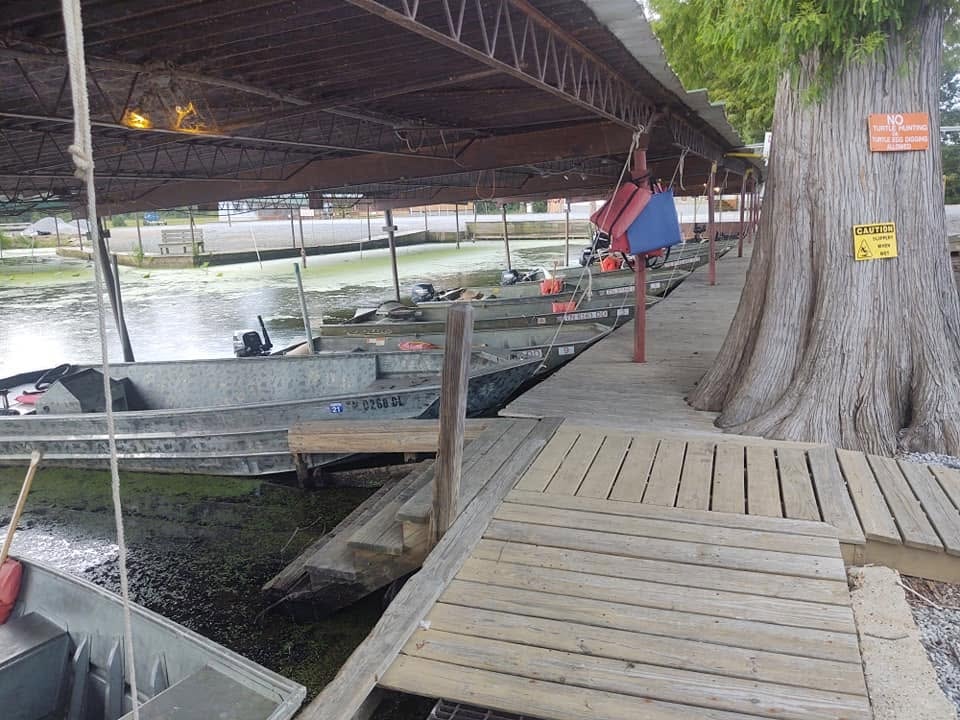 Jon boats docked under covered shelter at Southshore Resort