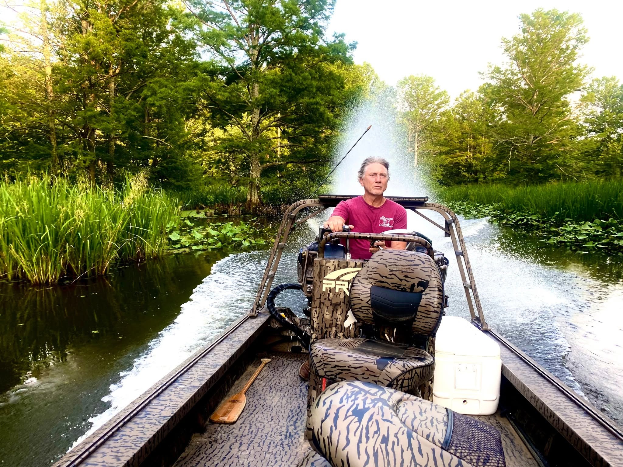 Tour guide navigating through the cypress channel on Reelfoot Lake