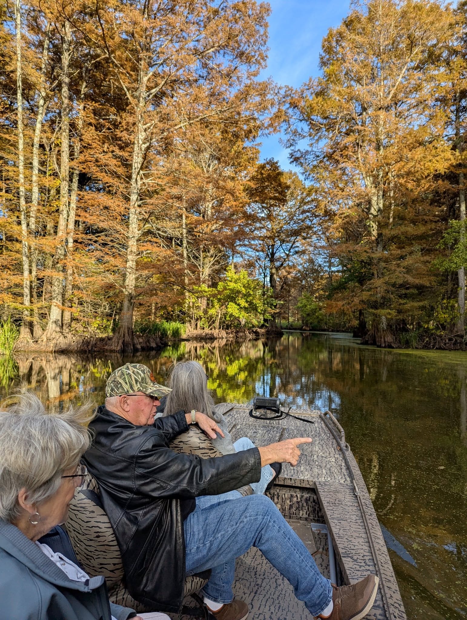 Group of guests taking in the autumn scenery on a Reelfoot Lake tour