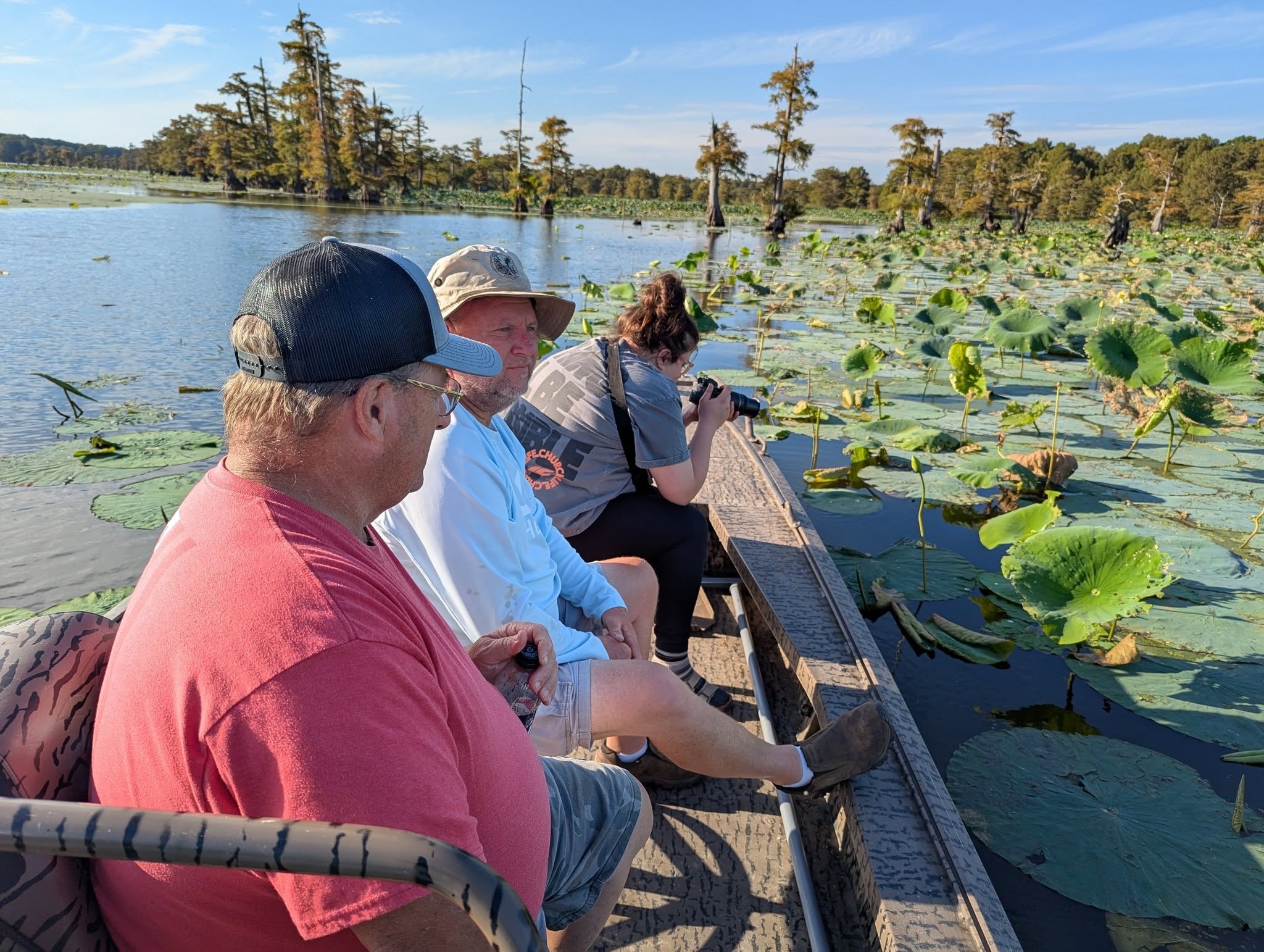 Guests enjoying the lotus fields on a Reelfoot Lake boat tour