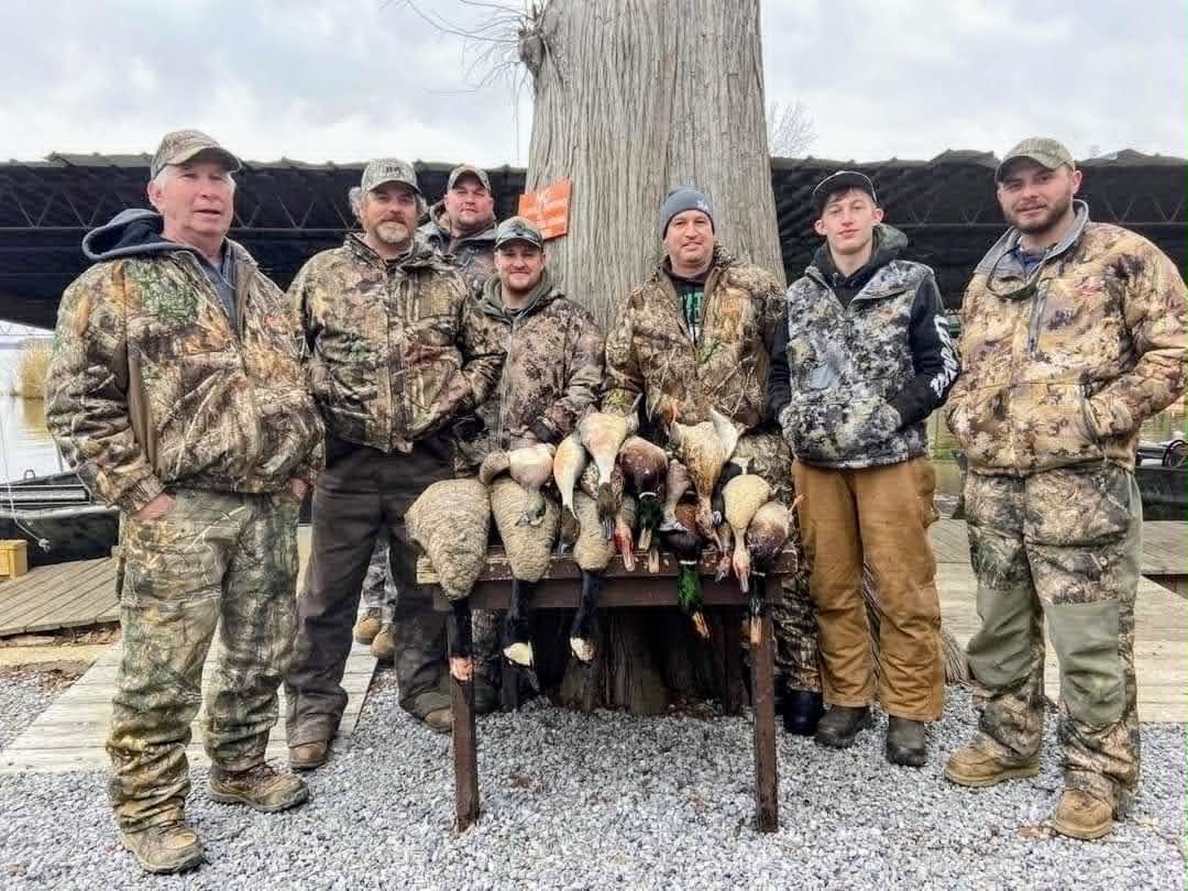 Hunters posing with duck harvest at Southshore Resort