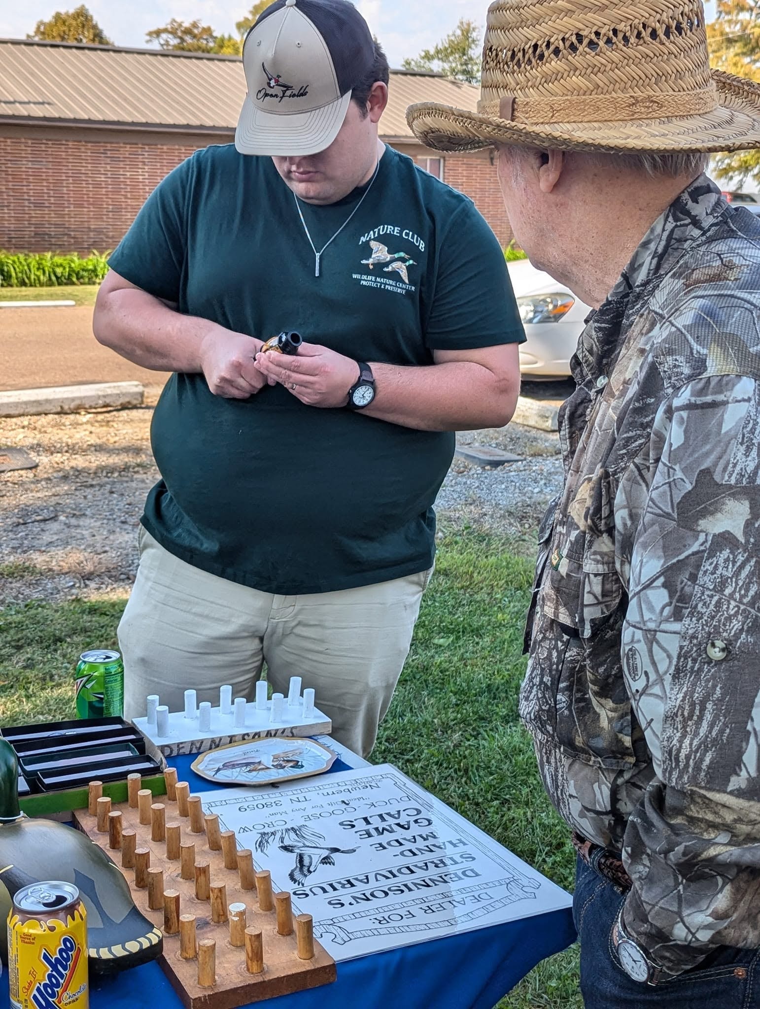 Attendees examining duck calls at the festival