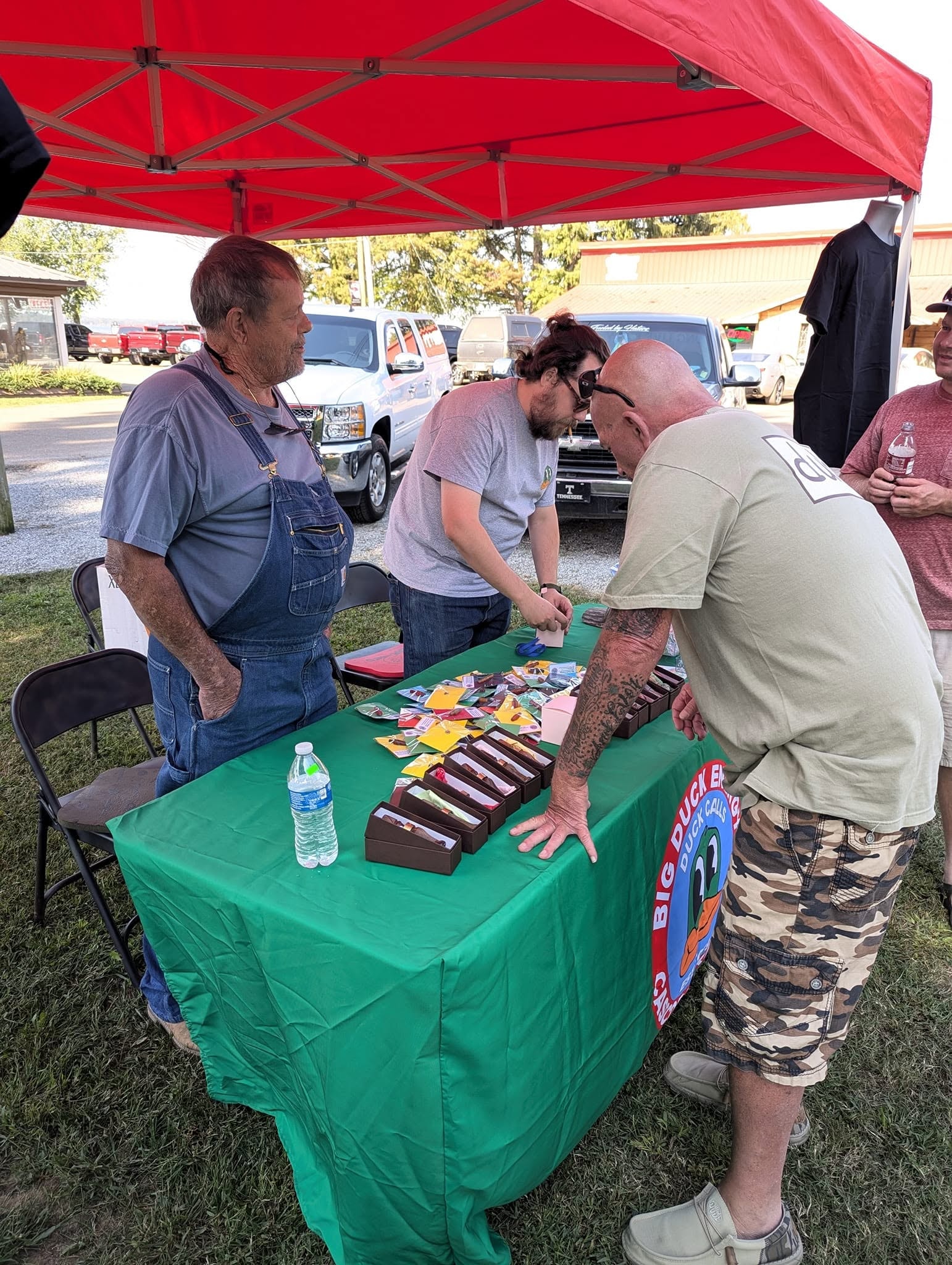 People gathered under red tent at the festival