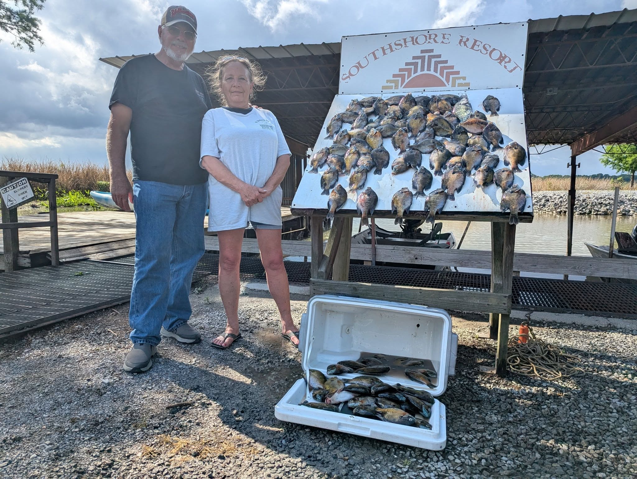 Couple with a full catch board at Southshore Resort