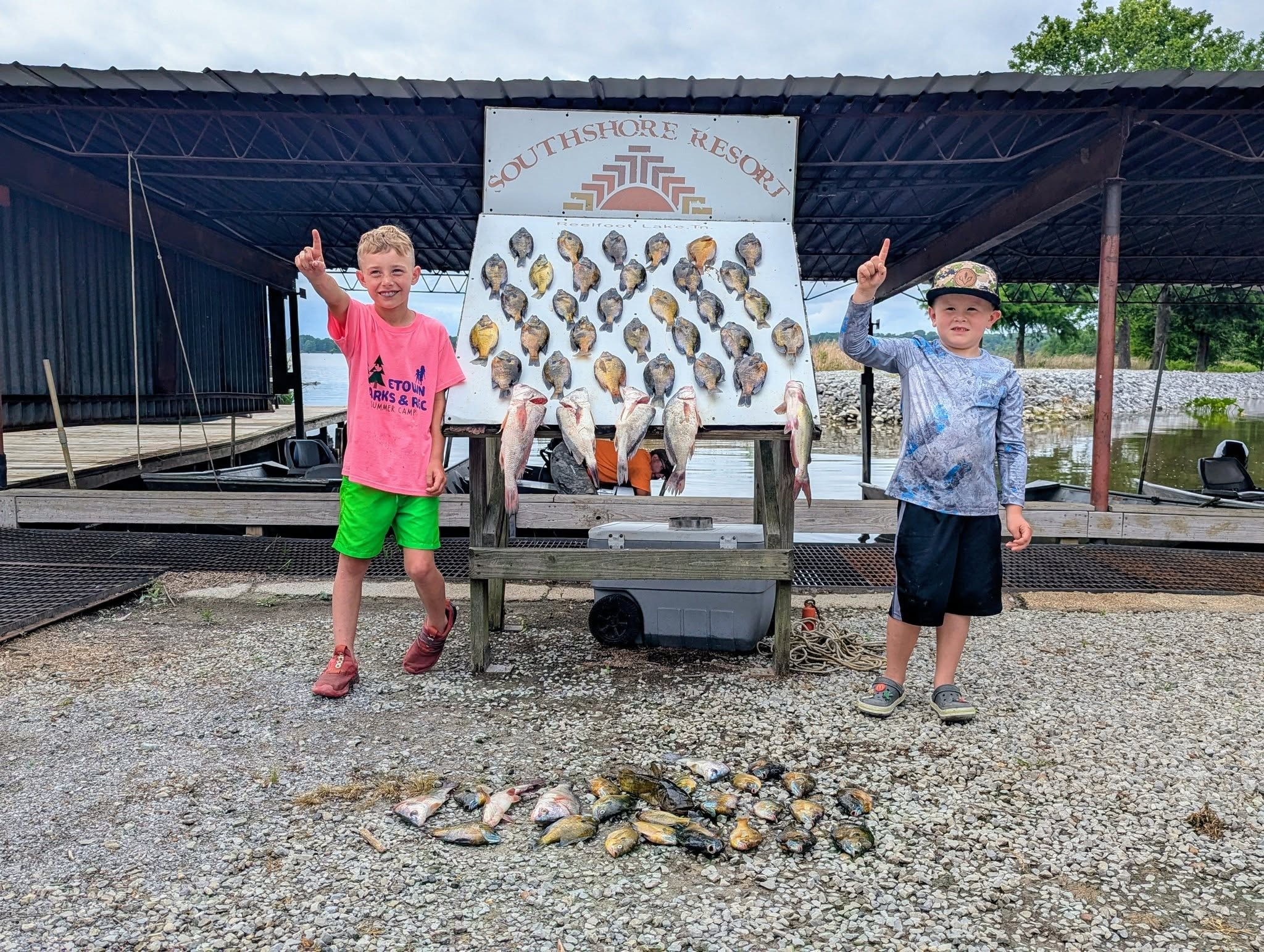 Two kids celebrating their big catch