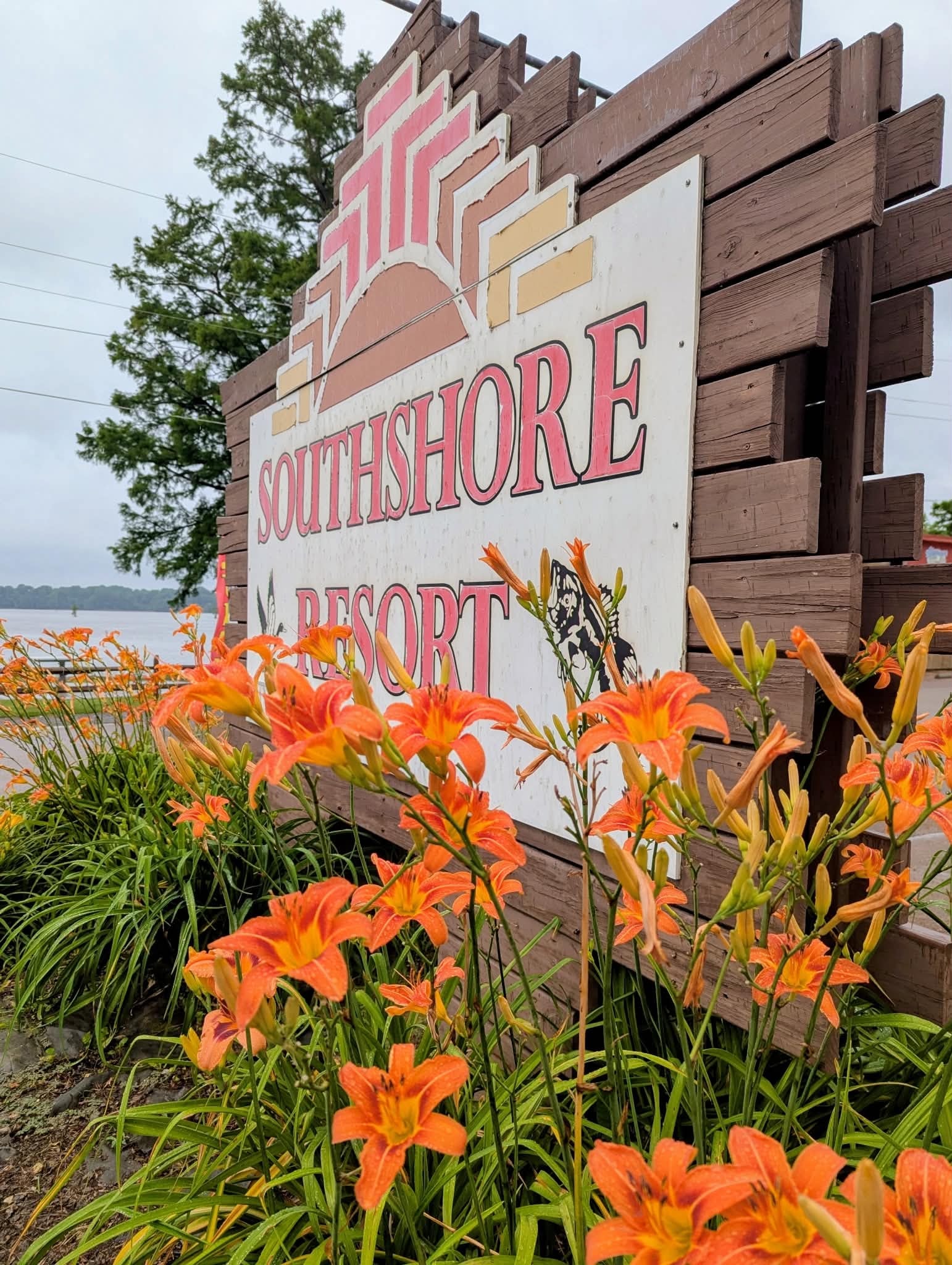 Southshore Resort sign surrounded by orange flowers