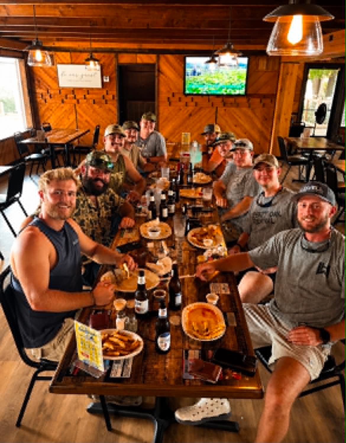Large group of friends dining together at The Boat House Restaurant