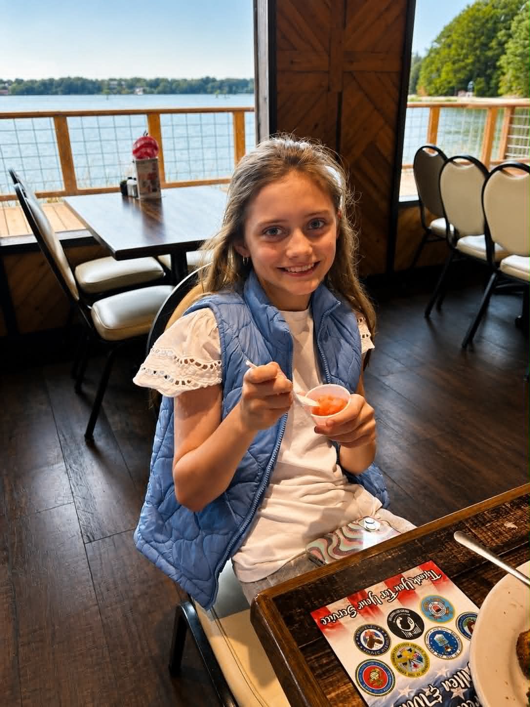 Young girl enjoying sherbet at The Boat House Restaurant with Reelfoot Lake views