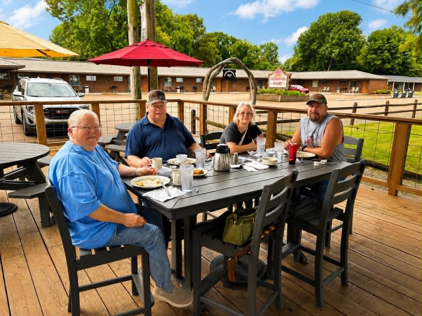 Guests dining on the outdoor deck at Southshore Resort with Reelfoot Lake views