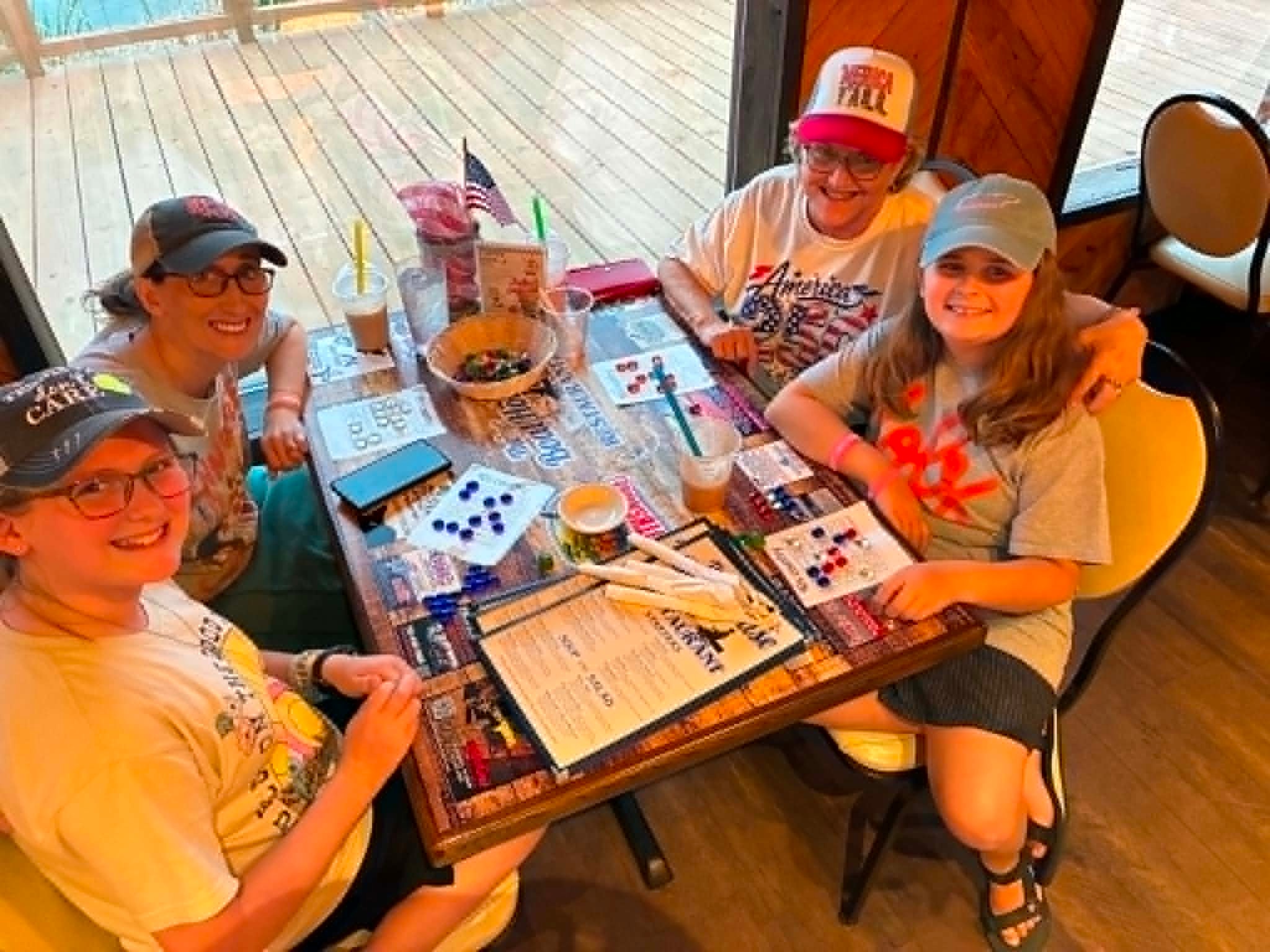 Family group playing Bingo at The Boat House Restaurant with lake views