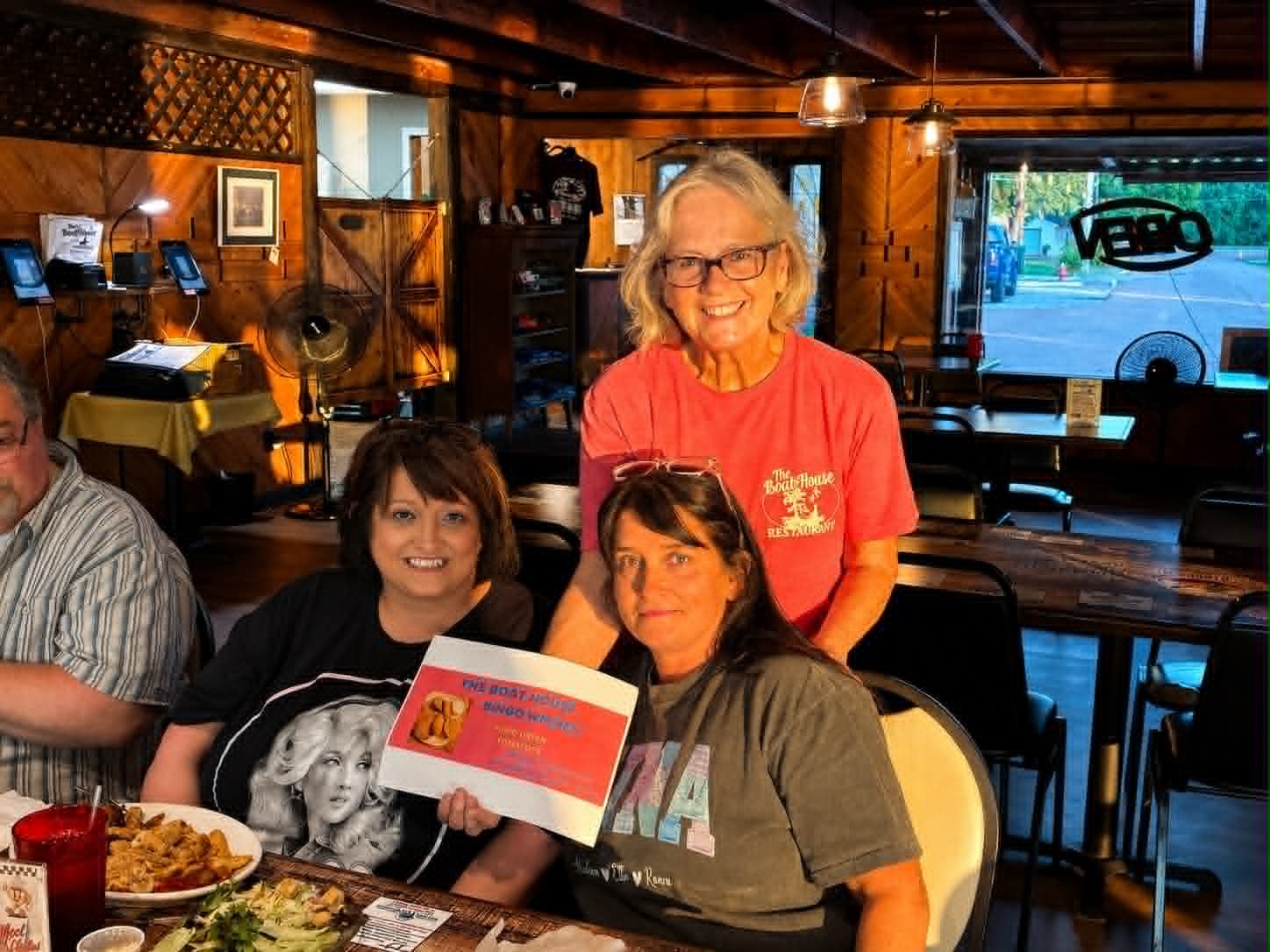 Boat House Bingo winners celebrating inside The Boat House Restaurant