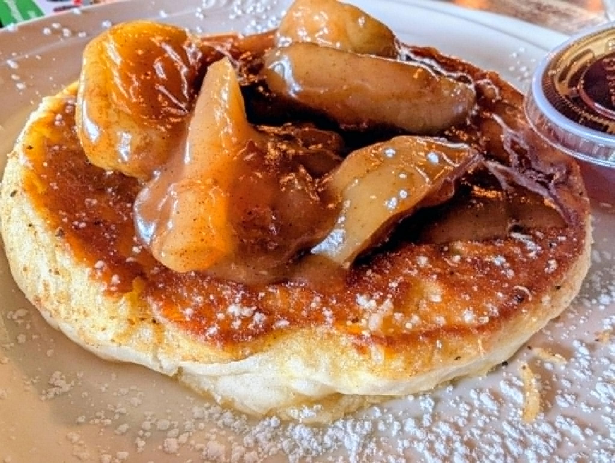 Banana foster pancake with caramel sauce and powdered sugar at The Boat House Restaurant