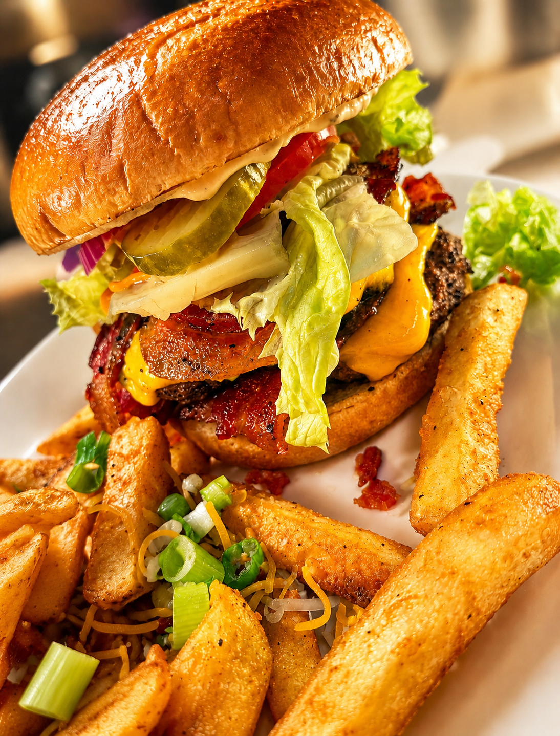 Loaded bacon cheeseburger with fries at The Boat House Restaurant