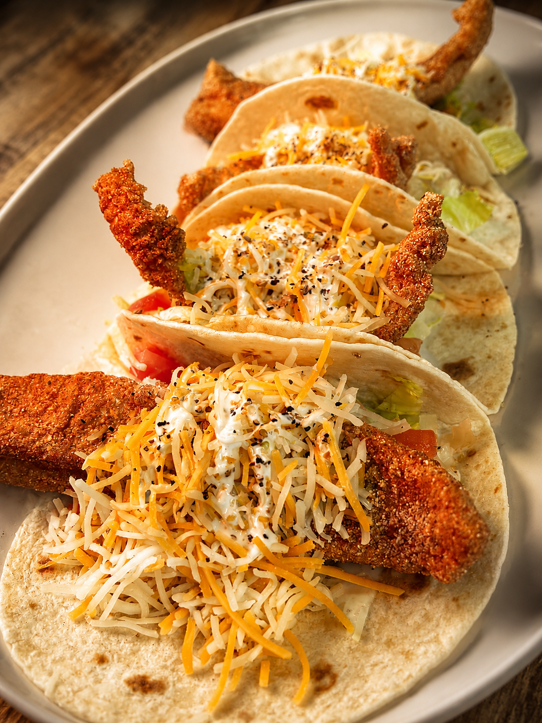 Fried fish tacos with shredded cheese and slaw at The Boat House Restaurant