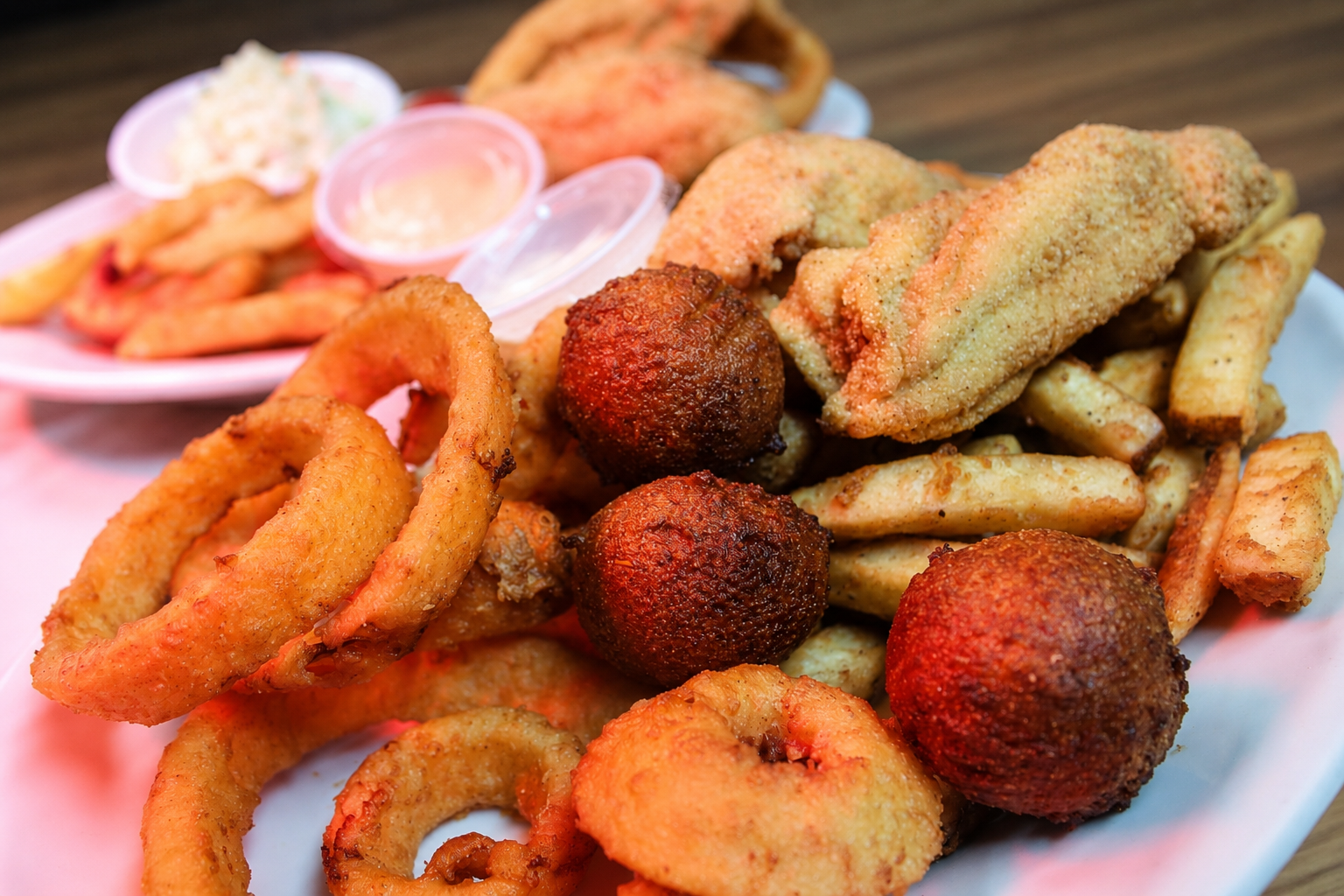 Fried catfish, hush puppies, onion rings and fries sampler platter