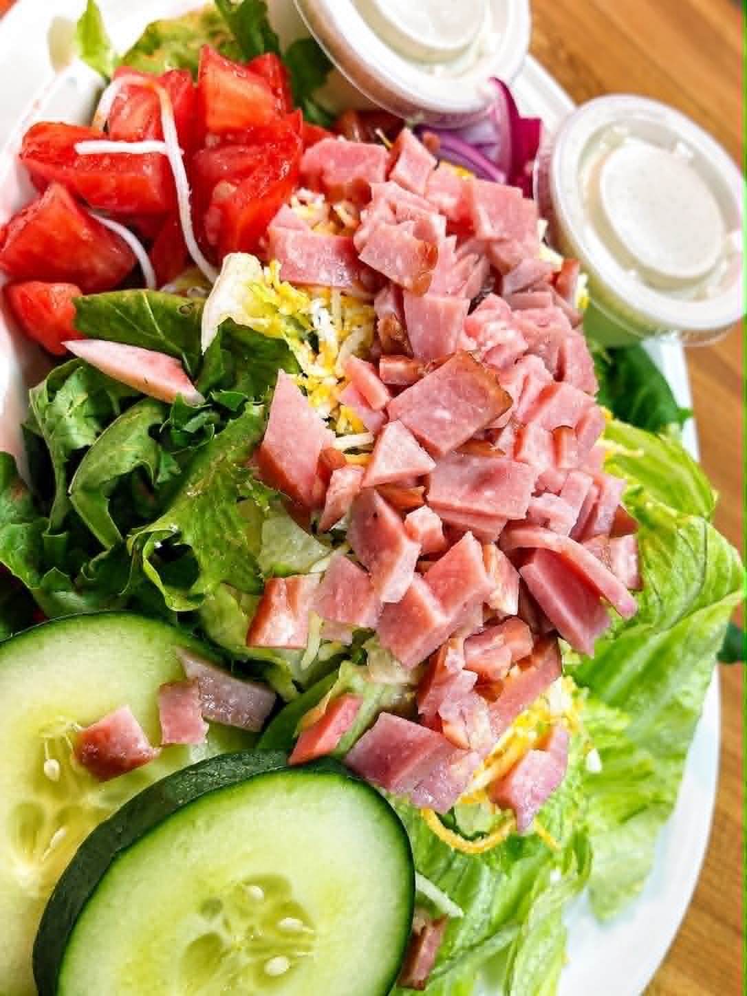 Fresh garden salad with diced ham, tomatoes, cucumber and cheese at The Boat House Restaurant