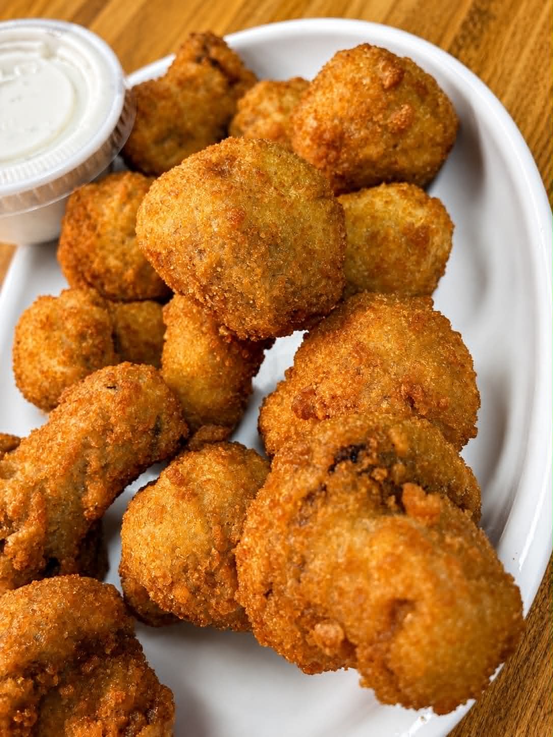 Golden hush puppies with ranch dipping sauce at The Boat House Restaurant