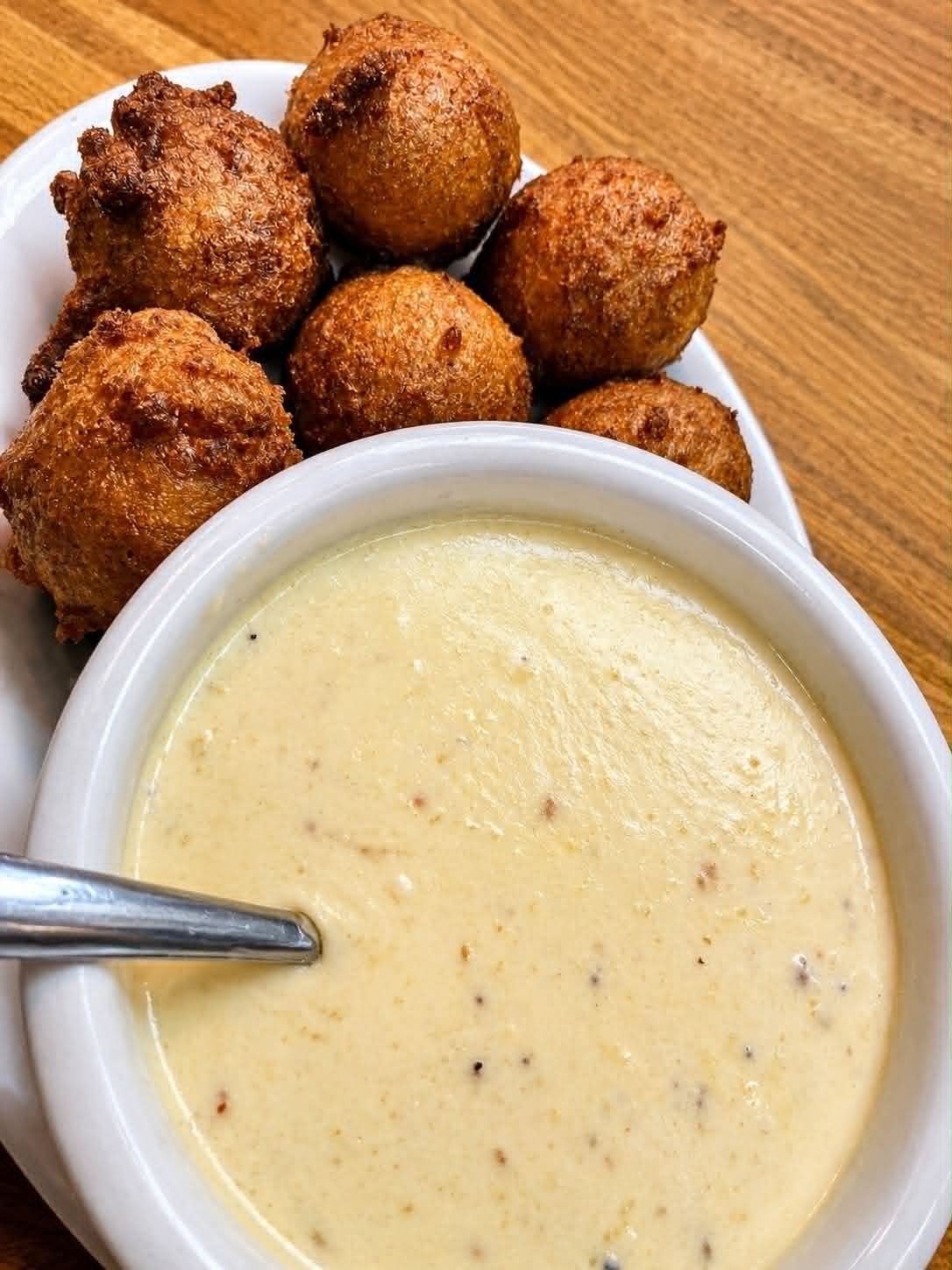 Hush puppies with creamy mustard dipping sauce at The Boat House Restaurant