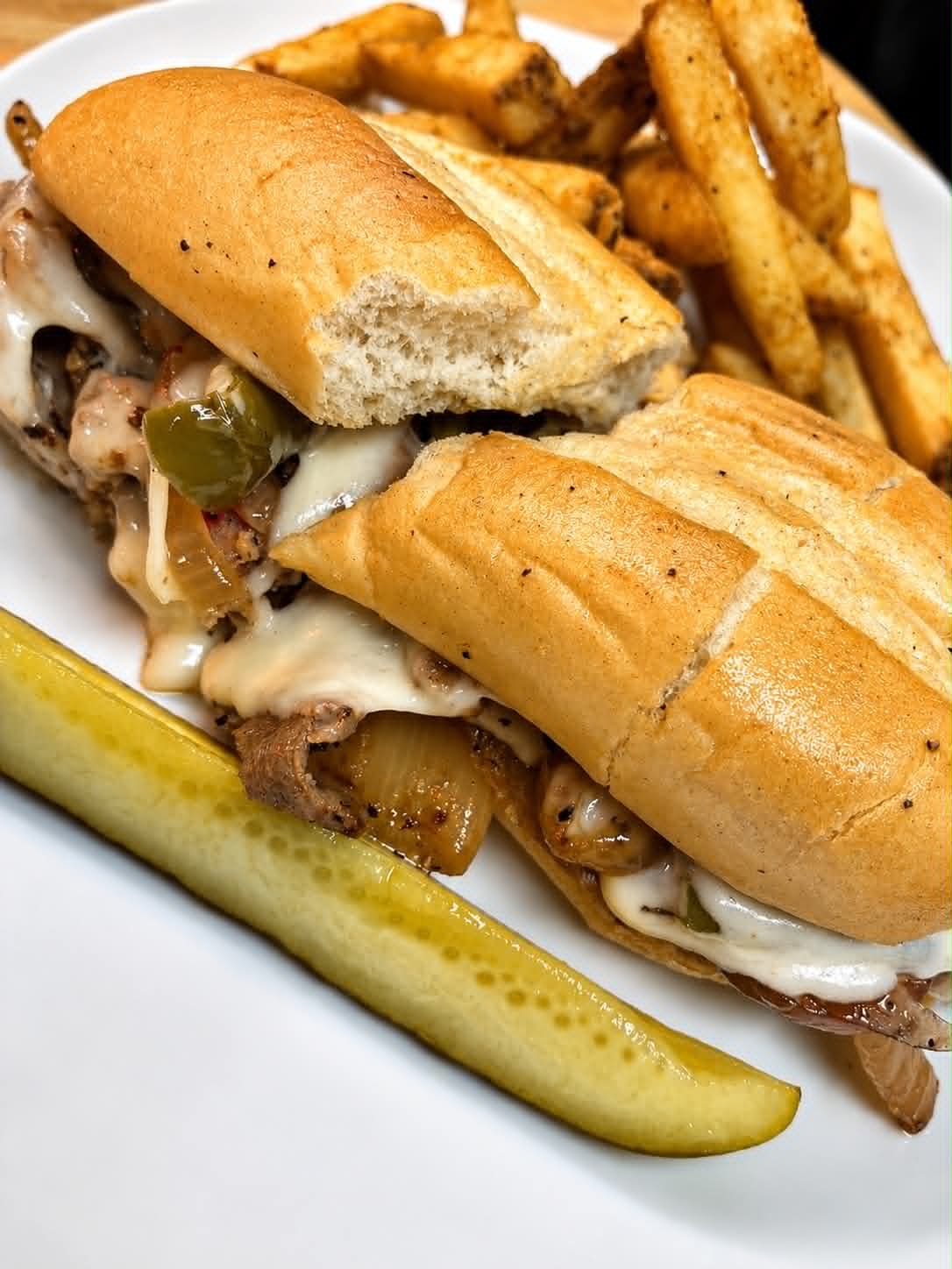Philly cheesesteak sub with peppers, onions and melted cheese at The Boat House Restaurant