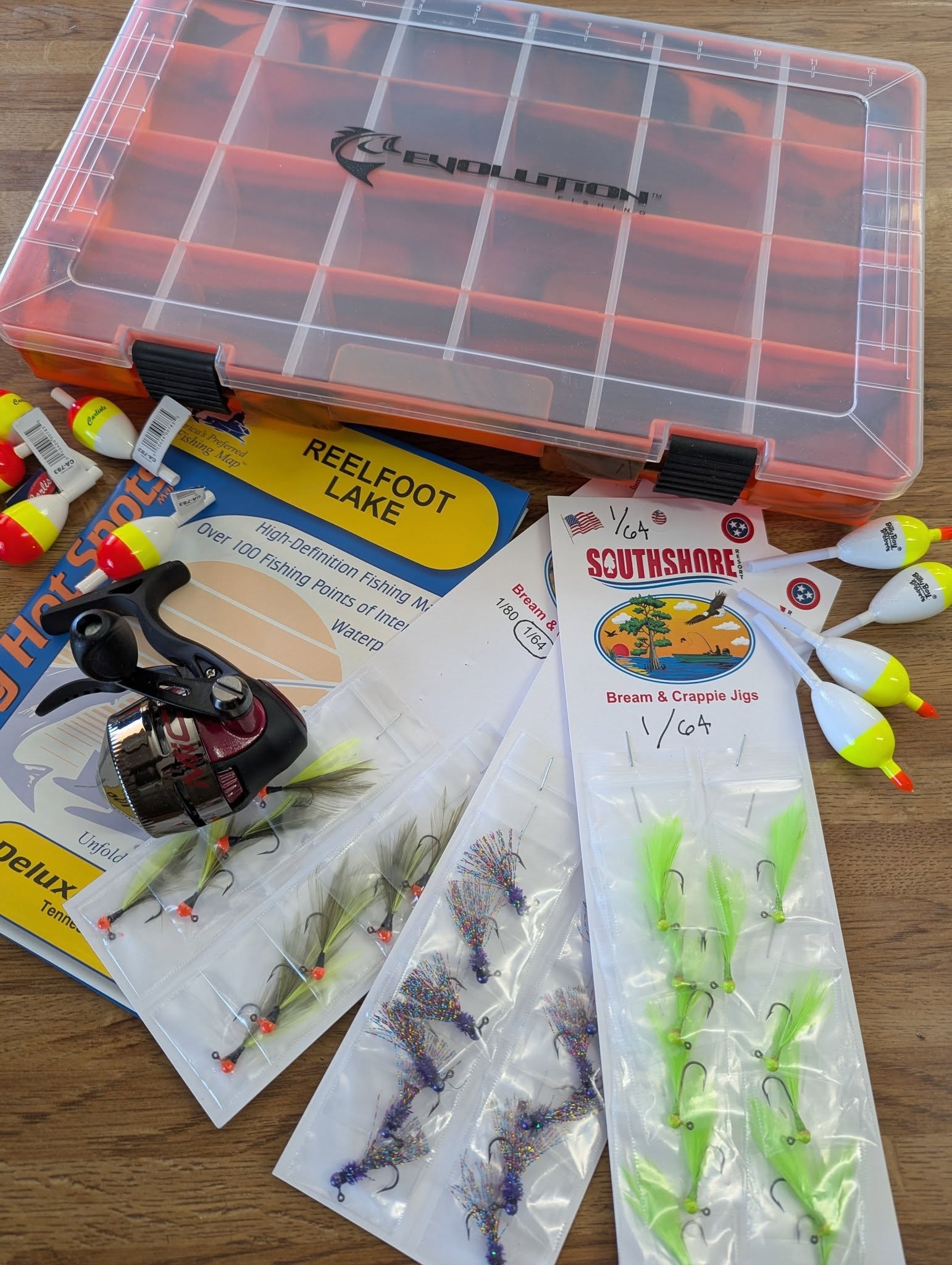 Tackle box spread with Reelfoot Lake map and Southshore jigs