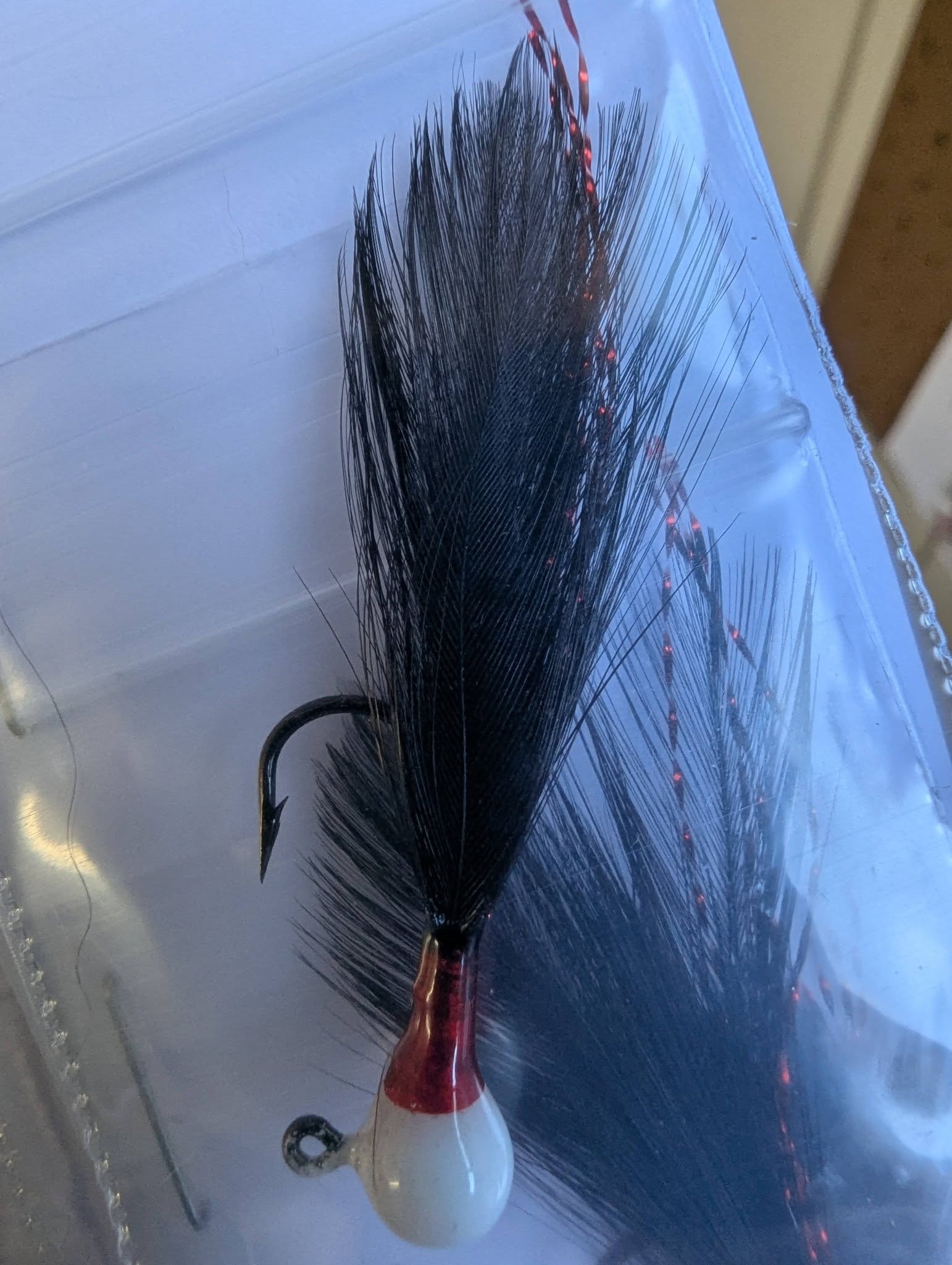Black feather fishing jig close-up
