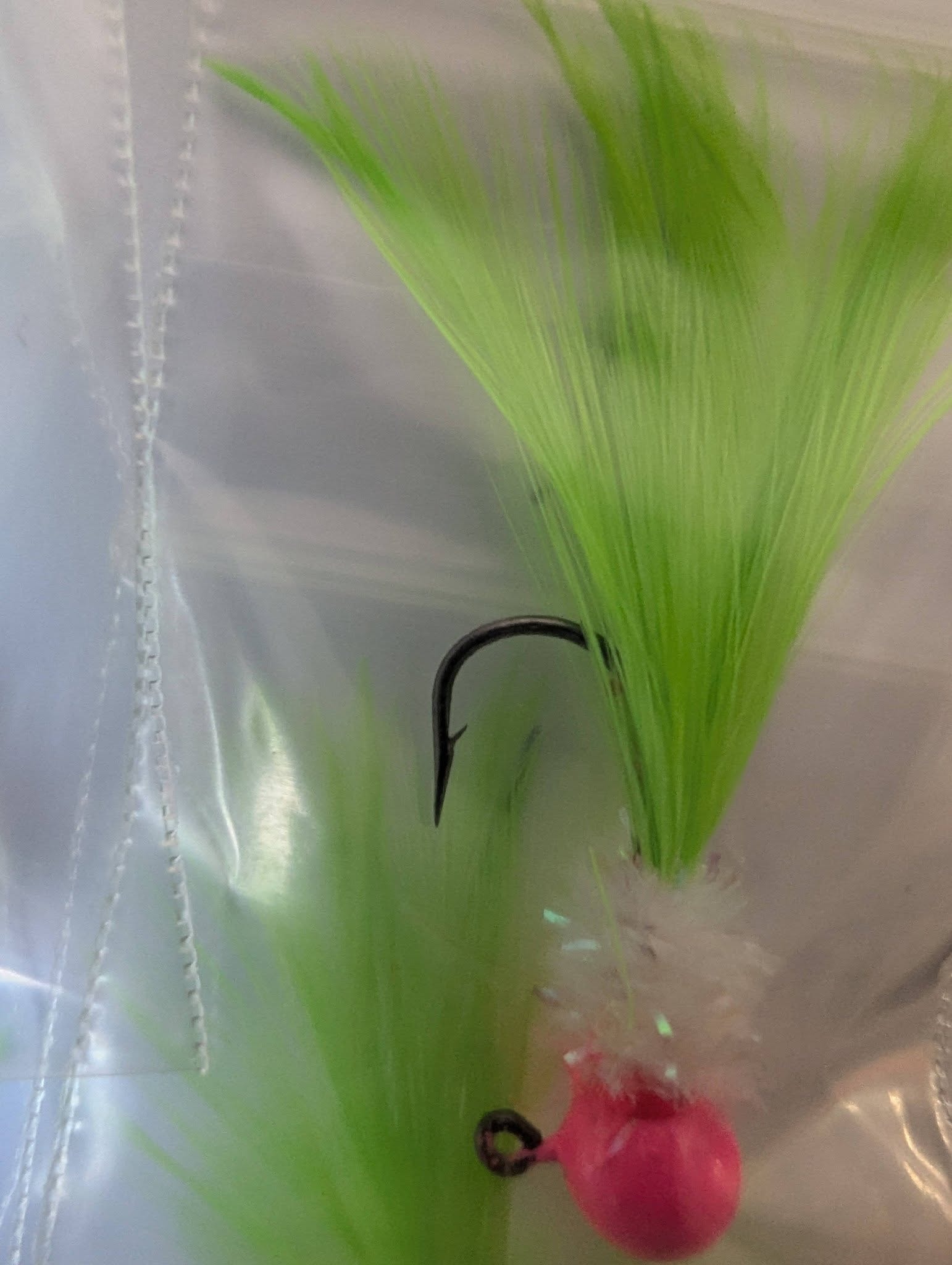 Green feather fishing jig close-up